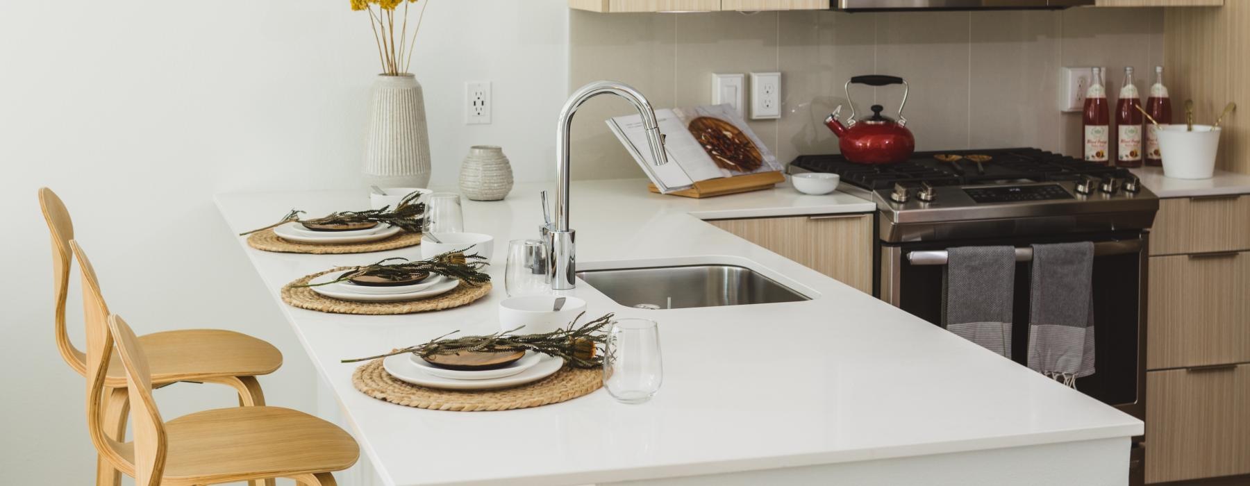 a kitchen with a table and chairs