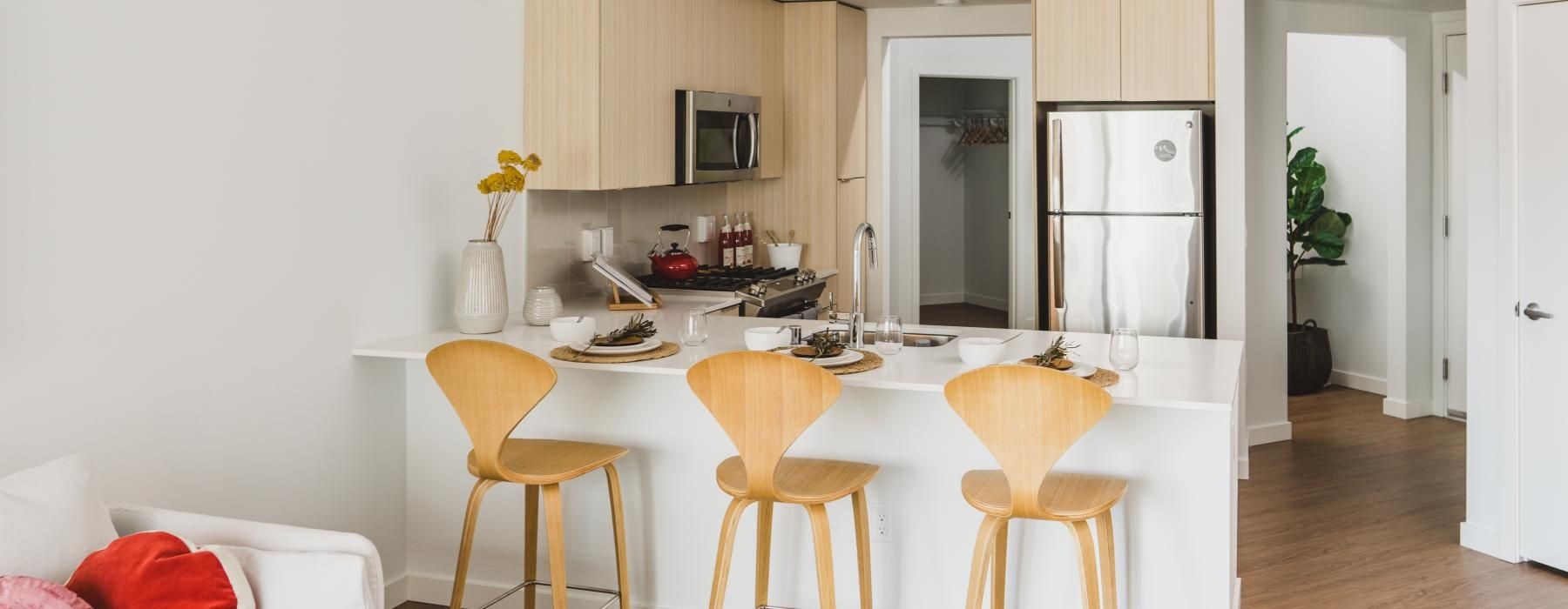 a kitchen with a table and chairs