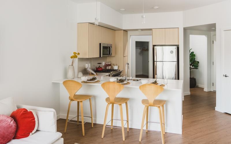 a kitchen with a table and chairs